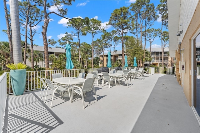 3001 Sandpiper Bay Cir Unit B103, Naples, FL 34112 - view of patio / terrace featuring outdoor dining space