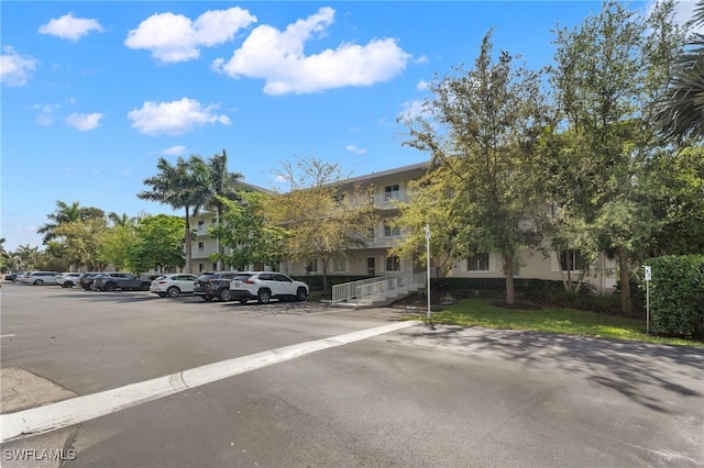 3001 Sandpiper Bay Cir Unit B103, Naples, FL 34112 - view of property with uncovered parking