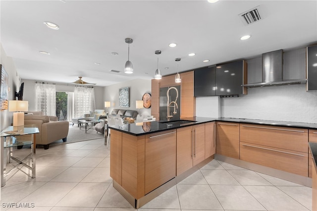 3001 Sandpiper Bay Cir Unit B103, Naples, FL 34112 - kitchen with wall chimney range hood, light tile patterned flooring, a sink, dark countertops, and hanging light fixtures