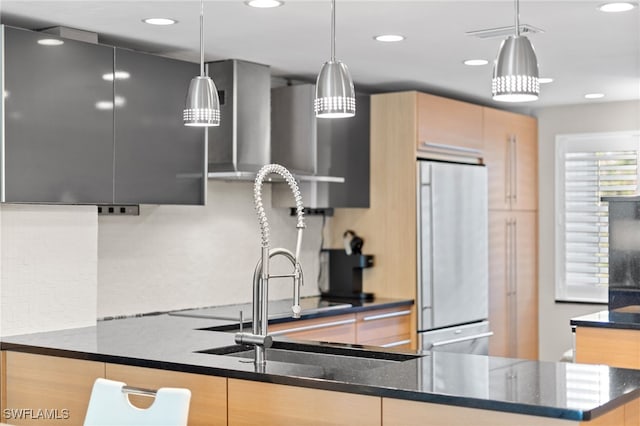 3001 Sandpiper Bay Cir Unit B103, Naples, FL 34112 - kitchen with fridge, light brown cabinetry, recessed lighting, hanging light fixtures, and dark stone counters