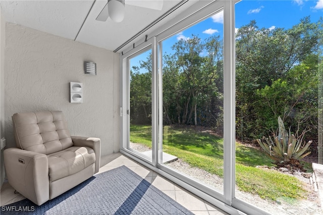 3001 Sandpiper Bay Cir Unit B103, Naples, FL 34112 - sunroom with a textured wall and tile patterned flooring