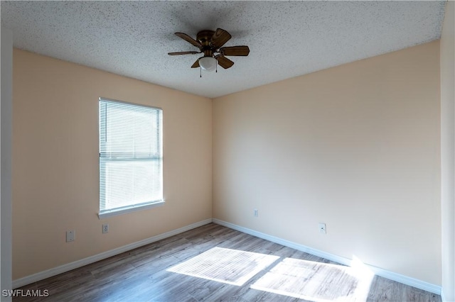 2022 Hunters Trace Cir, Middleburg, FL 32068 - unfurnished room featuring wood finished floors, a ceiling fan, and baseboards