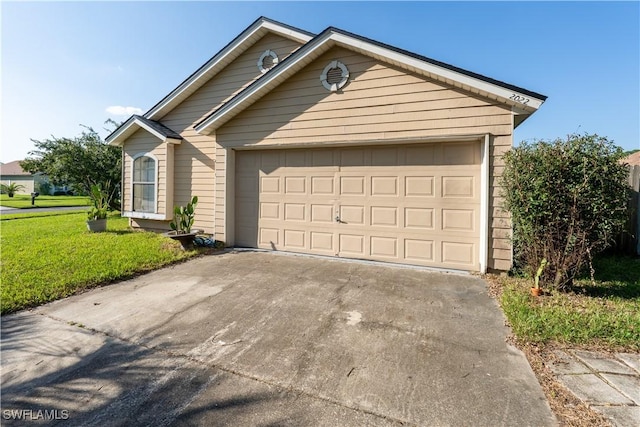 2022 Hunters Trace Cir, Middleburg, FL 32068 - view of front facade featuring concrete driveway, a garage, and a front yard