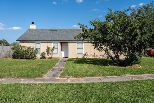 2022 Hunters Trace Cir, Middleburg, FL 32068 - view of front facade with a chimney, roof with shingles, and stucco siding