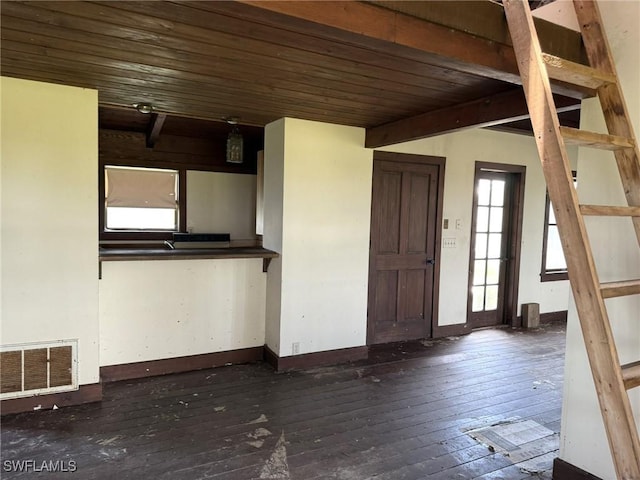 310 Pieces Of Eight, Captiva, FL 33924 - entryway with dark wood finished floors, baseboards, and wood ceiling with exposed beams