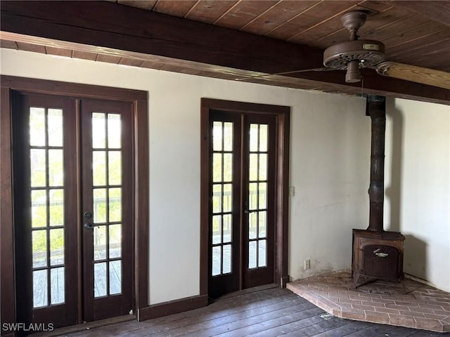 310 Pieces Of Eight, Captiva, FL 33924 - doorway to outside featuring french doors, plenty of natural light, wood ceiling with exposed beams, wood-type flooring, and a wood stove