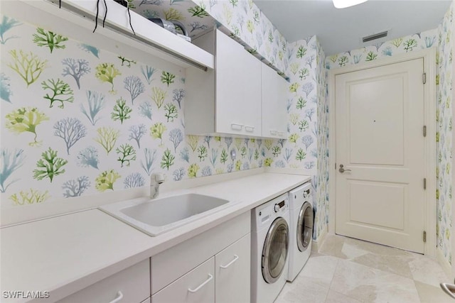 970 Cape Marco Dr Unit 2105, Marco Island, FL 34145 - washroom with wallpapered walls, cabinet space, and washer and clothes dryer