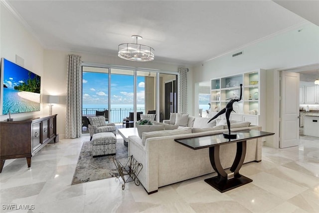 970 Cape Marco Dr Unit 2105, Marco Island, FL 34145 - living area with crown molding, a chandelier, light marble finish floors, and a water view