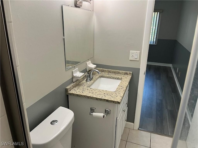 6184 Michelle Way Unit 123, Fort Myers, FL 33919 - bathroom with vanity, toilet, baseboards, and tile patterned floors