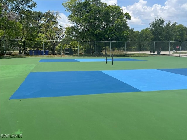 6184 Michelle Way Unit 123, Fort Myers, FL 33919 - view of tennis court with view of wooded area