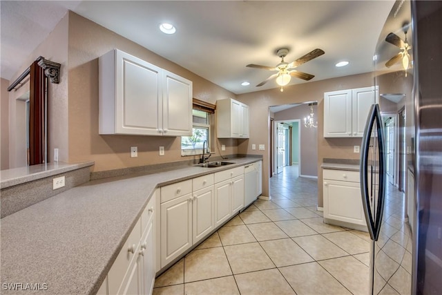 1601 SW 19th St, Cape Coral, FL 33991 - kitchen featuring freestanding refrigerator, white dishwasher, ceiling fan, a sink, and white cabinets