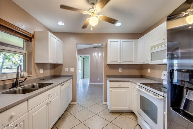 1601 SW 19th St, Cape Coral, FL 33991 - kitchen with white appliances, a sink, light tile patterned floors, white cabinets, and a ceiling fan