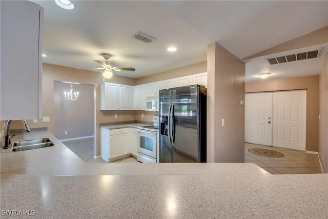 1601 SW 19th St, Cape Coral, FL 33991 - kitchen with white appliances, a sink, a ceiling fan, baseboards, and white cabinets