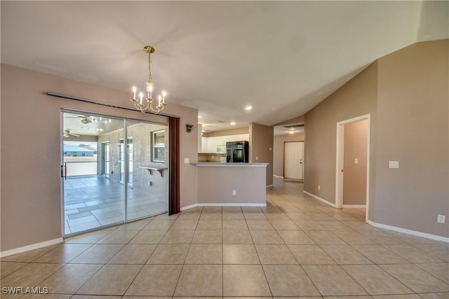 1601 SW 19th St, Cape Coral, FL 33991 - unfurnished room featuring lofted ceiling, a chandelier, light tile patterned floors, and baseboards