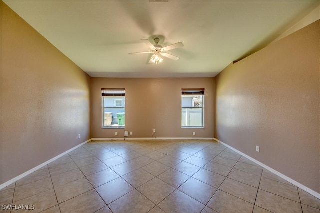 1601 SW 19th St, Cape Coral, FL 33991 - spare room featuring a ceiling fan, light tile patterned floors, and baseboards