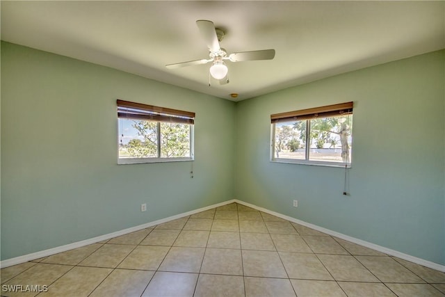 1601 SW 19th St, Cape Coral, FL 33991 - spare room featuring healthy amount of natural light, ceiling fan, light tile patterned floors, and baseboards