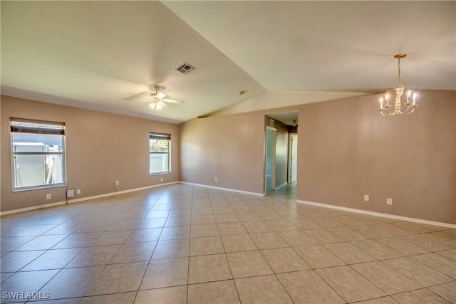 1601 SW 19th St, Cape Coral, FL 33991 - spare room with vaulted ceiling, a ceiling fan, light tile patterned floors, a chandelier, and baseboards