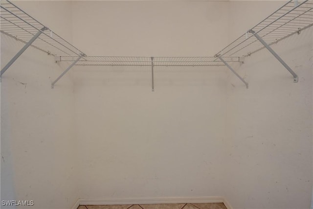 1601 SW 19th St, Cape Coral, FL 33991 - spacious closet with light tile patterned floors
