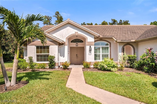 28996 Seton Ct, Bonita Springs, FL 34134 - single story home with stucco siding, a front lawn, and a tile roof
