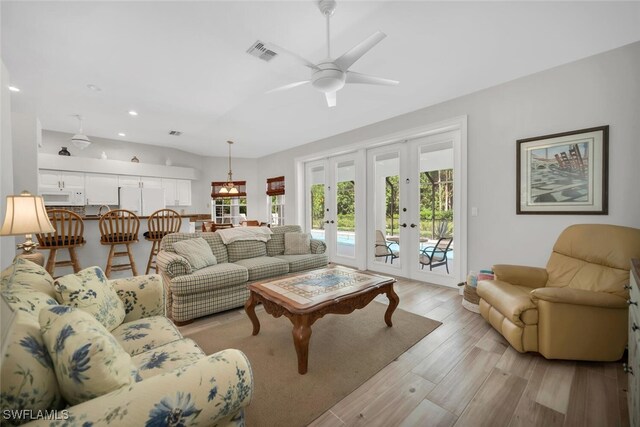 28996 Seton Ct, Bonita Springs, FL 34134 - living room with ceiling fan, french doors, recessed lighting, and light wood-style floors