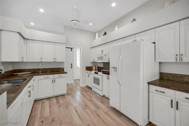 28996 Seton Ct, Bonita Springs, FL 34134 - kitchen with white appliances, a sink, white cabinetry, recessed lighting, and light wood finished floors