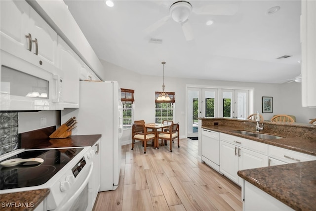 28996 Seton Ct, Bonita Springs, FL 34134 - kitchen with a sink, white appliances, a ceiling fan, white cabinetry, and light wood finished floors