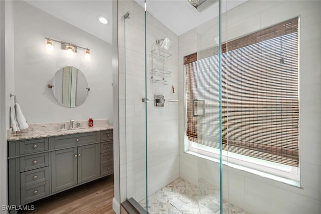 28996 Seton Ct, Bonita Springs, FL 34134 - full bath featuring a stall shower, vanity, and wood finished floors