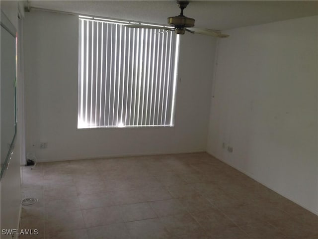 3760 Inverrary Dr Unit 1W, Lauderhill, FL 33319 - tiled empty room featuring a ceiling fan