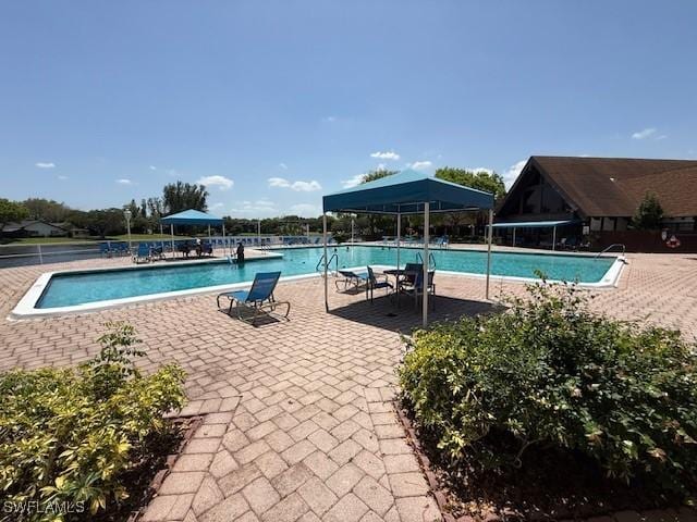3760 Inverrary Dr Unit 1W, Lauderhill, FL 33319 - community pool featuring a gazebo and a patio area