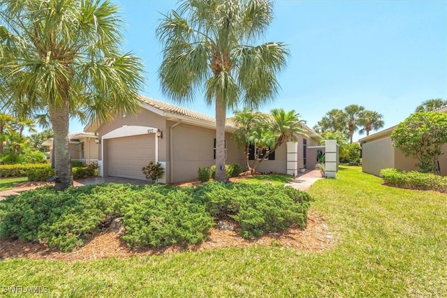 9327 Trieste Dr, Fort Myers, FL 33913 - view of front of property with a garage, stucco siding, and a front yard