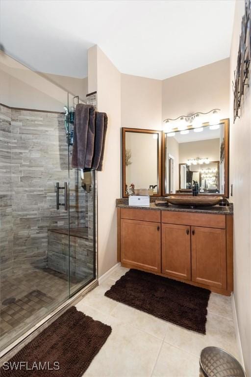 9327 Trieste Dr, Fort Myers, FL 33913 - full bathroom featuring a stall shower, tile patterned floors, vanity, and baseboards