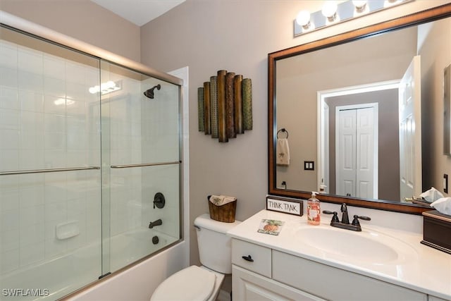 9327 Trieste Dr, Fort Myers, FL 33913 - full bath with vanity, bath / shower combo with glass door, and toilet