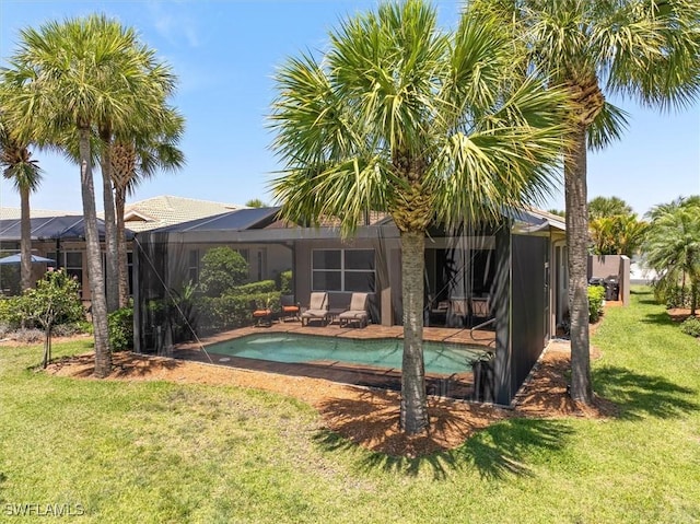 9327 Trieste Dr, Fort Myers, FL 33913 - outdoor pool featuring a yard and glass enclosure