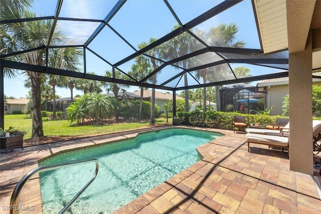 9327 Trieste Dr, Fort Myers, FL 33913 - outdoor pool with a patio, a lawn, and a lanai