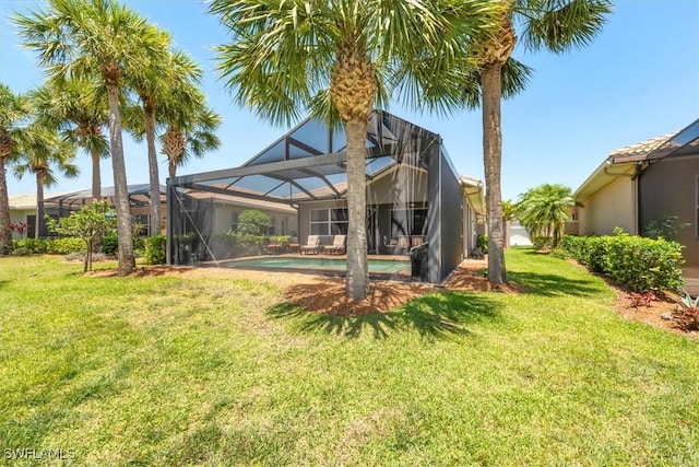 9327 Trieste Dr, Fort Myers, FL 33913 - back of property featuring a yard, stucco siding, and an outdoor pool