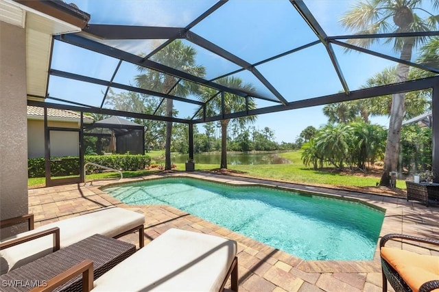9327 Trieste Dr, Fort Myers, FL 33913 - outdoor pool featuring a water view, a patio, and glass enclosure
