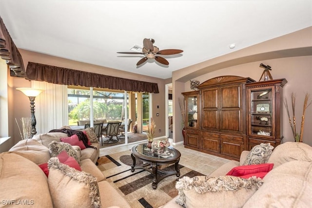 9327 Trieste Dr, Fort Myers, FL 33913 - living room featuring a ceiling fan, light tile patterned floors, and baseboards