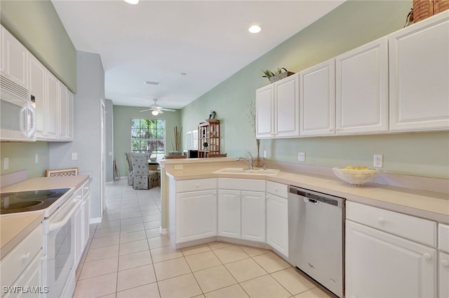 10020 Sky View Way Unit 905, Fort Myers, FL 33913 - kitchen featuring white appliances, a sink, a peninsula, ceiling fan, and white cabinetry