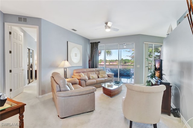 10020 Sky View Way Unit 905, Fort Myers, FL 33913 - living room with ceiling fan, baseboards, and light colored carpet