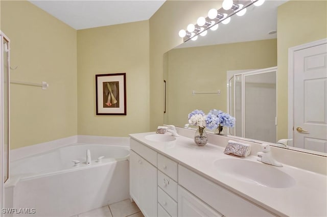 10020 Sky View Way Unit 905, Fort Myers, FL 33913 - full bath with double vanity, a stall shower, a garden tub, and tile patterned floors