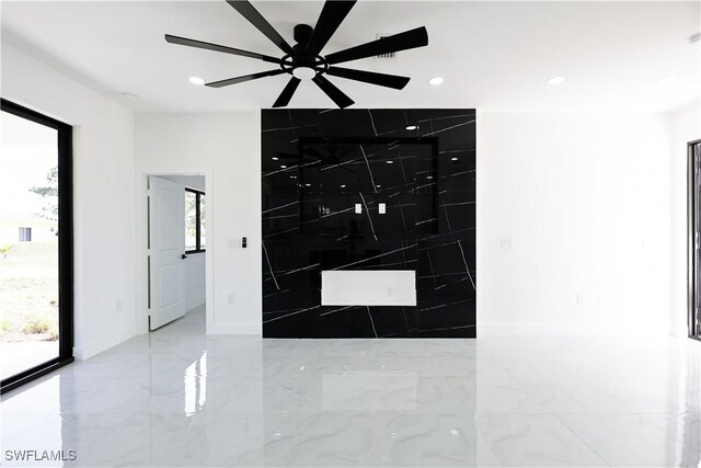 2933 20th St SW, Lehigh Acres, FL 33976 - unfurnished room featuring recessed lighting, ceiling fan, and marble tiled floors