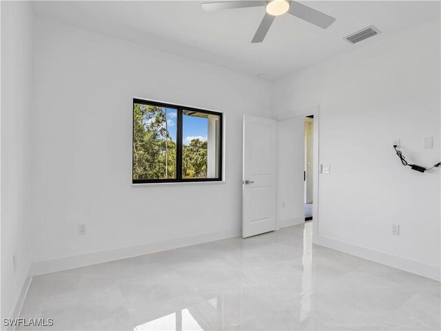 2933 20th St SW, Lehigh Acres, FL 33976 - unfurnished room with ceiling fan and baseboards