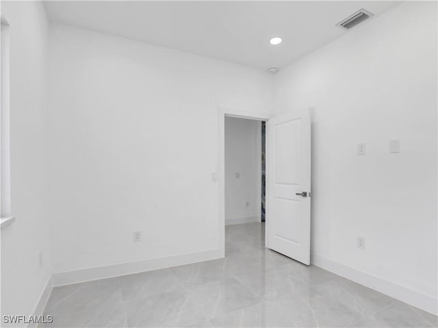 2933 20th St SW, Lehigh Acres, FL 33976 - empty room featuring baseboards and recessed lighting