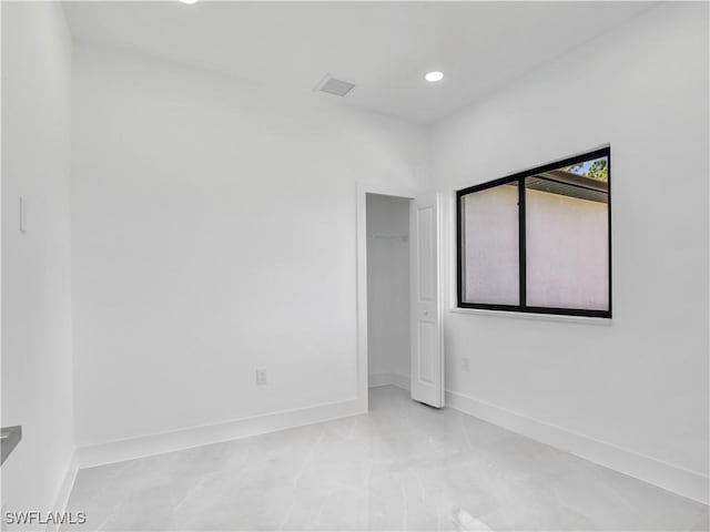 2933 20th St SW, Lehigh Acres, FL 33976 - unfurnished bedroom with recessed lighting and a closet