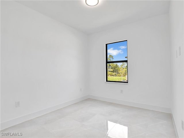 2933 20th St SW, Lehigh Acres, FL 33976 - spare room with baseboards