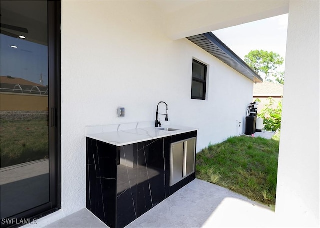 2933 20th St SW, Lehigh Acres, FL 33976 - bar area featuring a sink