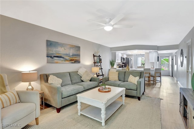 773 Wiggins Lake Dr Unit 101, Naples, FL 34110 - living area featuring ceiling fan and light wood-style floors