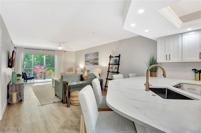 773 Wiggins Lake Dr Unit 101, Naples, FL 34110 - dining space featuring light wood finished floors, a ceiling fan, and recessed lighting