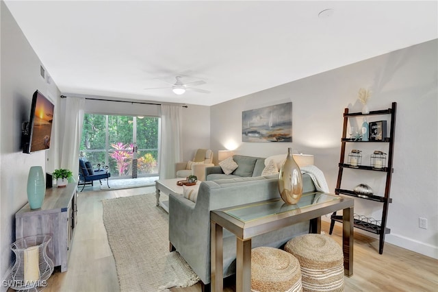 773 Wiggins Lake Dr Unit 101, Naples, FL 34110 - living area featuring a ceiling fan, light wood-style floors, and baseboards