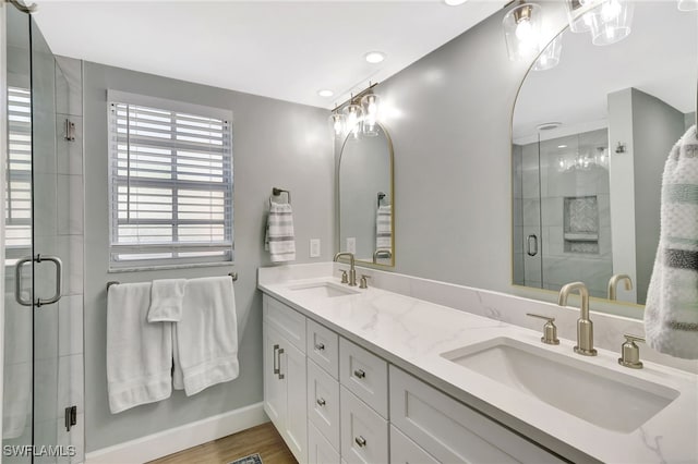 773 Wiggins Lake Dr Unit 101, Naples, FL 34110 - full bath with a stall shower, double vanity, baseboards, wood finished floors, and recessed lighting